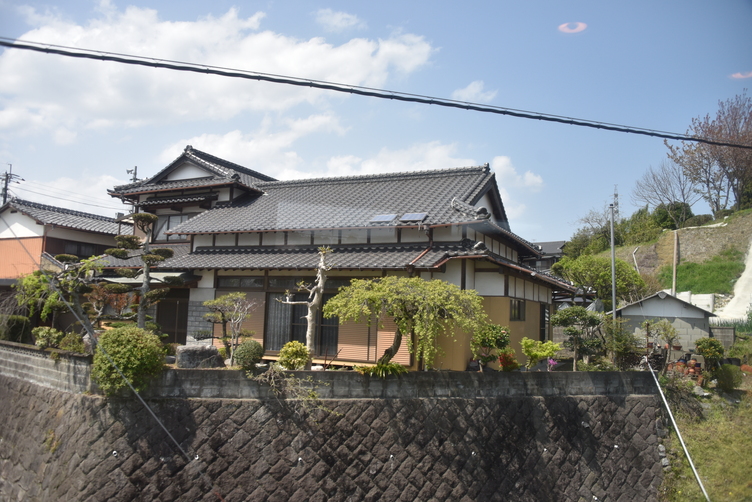 Japanese Home alongside Train Tracks